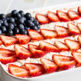 Strawberry Jello Poke Cake decorated like an American Flag.