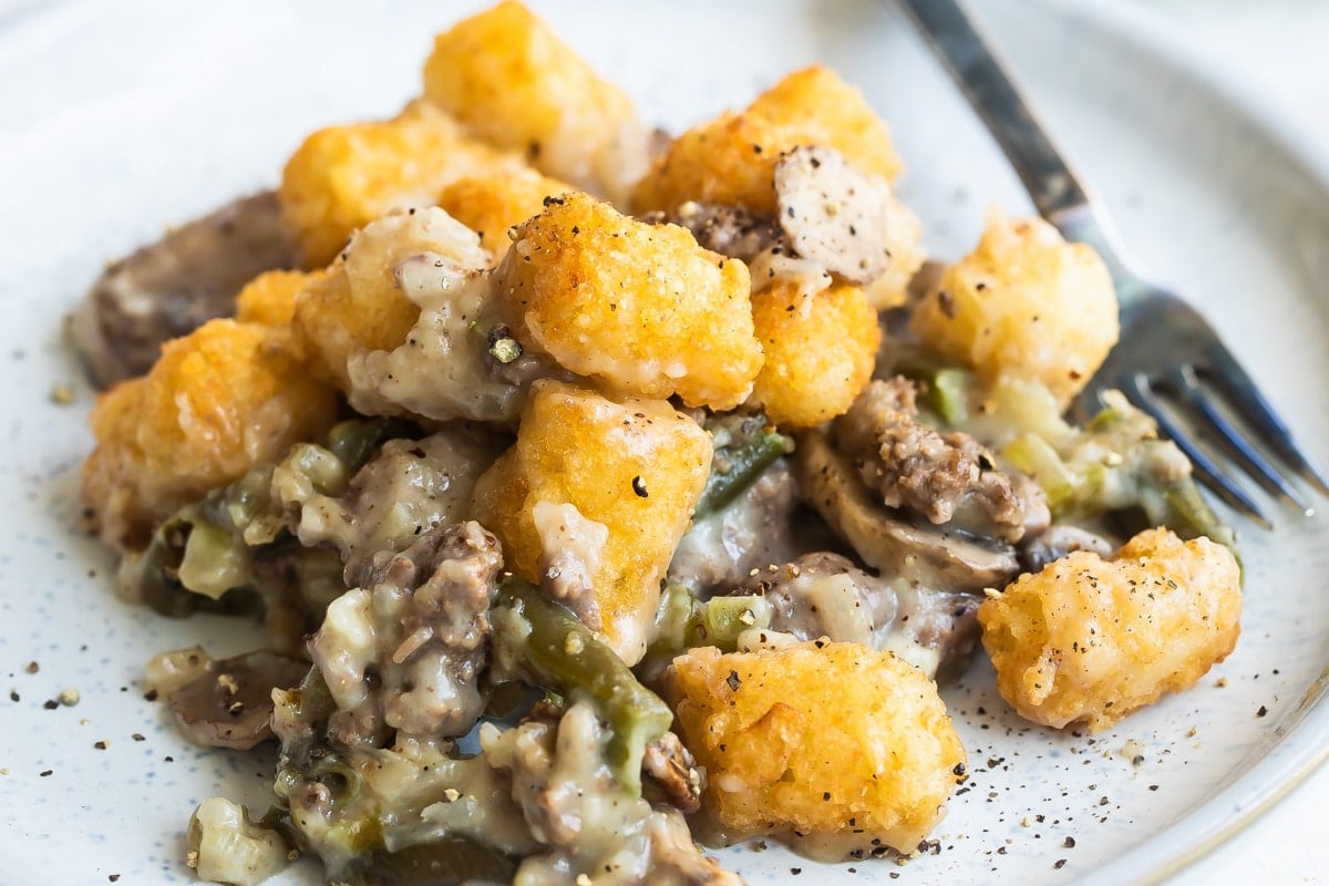 A serving of tater tot casserole on a white plate.