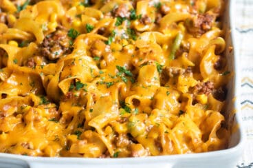 Beef noodle casserole in a white baking dish.