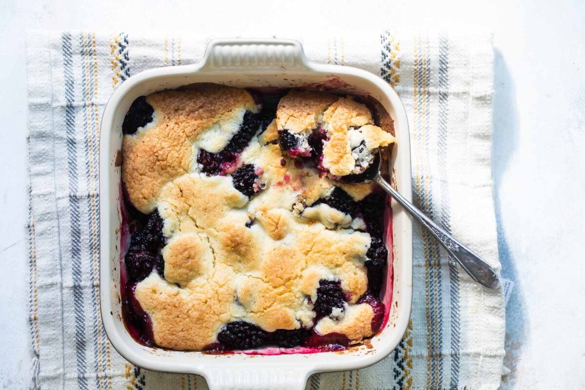 A baking dish of blackberry cobbler.