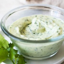 A clear dish of cilantro lime dressing.