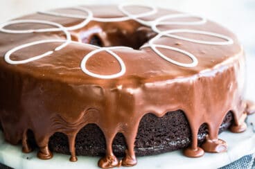 A ding dong cake on a marble cake stand.