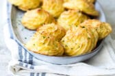 A platter of fluffy Duchess potatoes.
