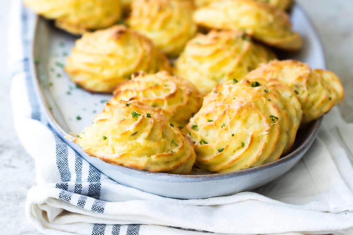 A platter of fluffy Duchess potatoes.