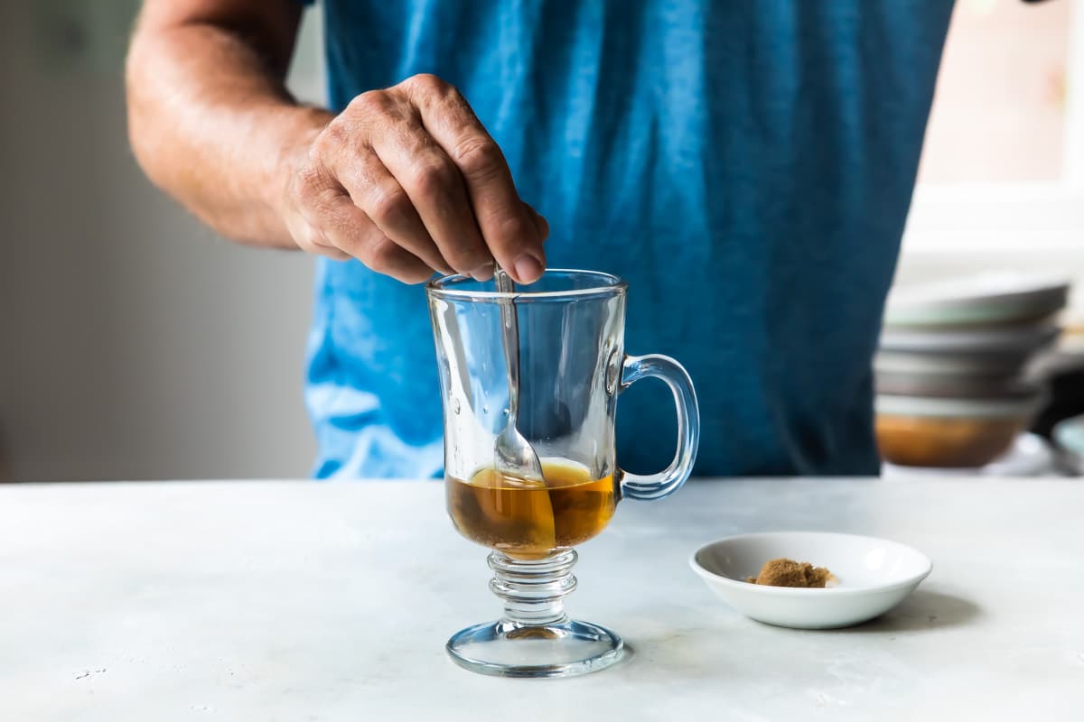 Making Irish coffee in a glass.