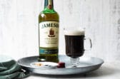 A tray with Irish Coffee and a bottle of Jameson Irish whiskey.