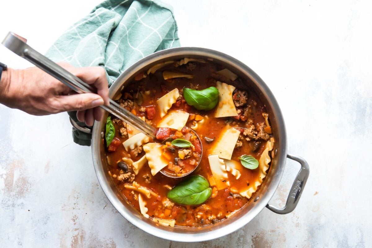 Lasagna soup in a silver pot.