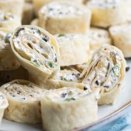 Mexican Tortilla roll ups on a serving platter.