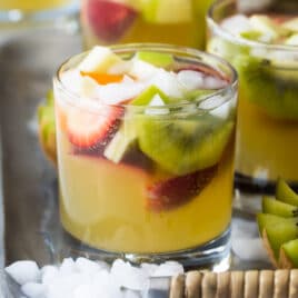 Moscato sangria in glasses on a serving tray.