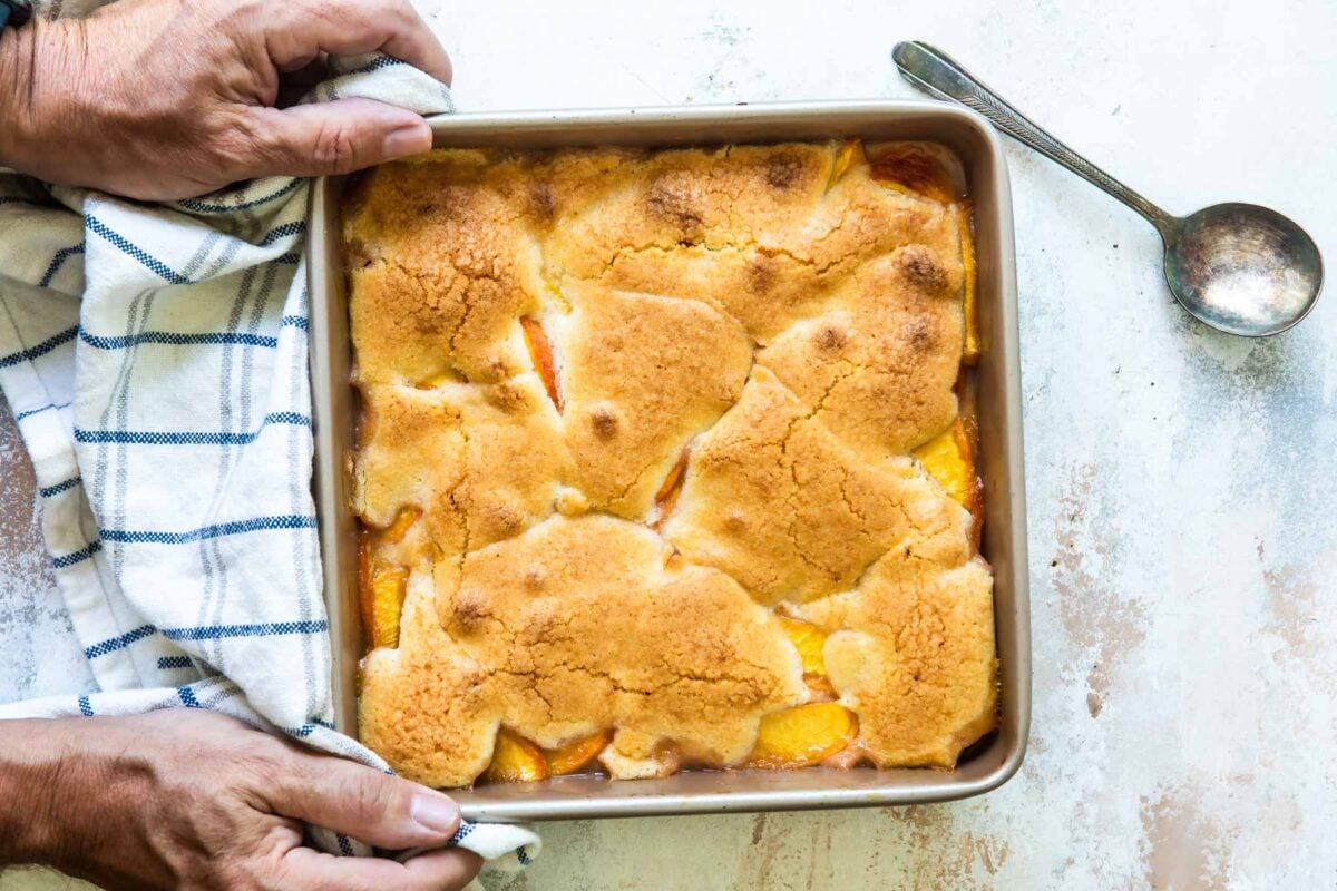 A baking dish of peach cobbler.