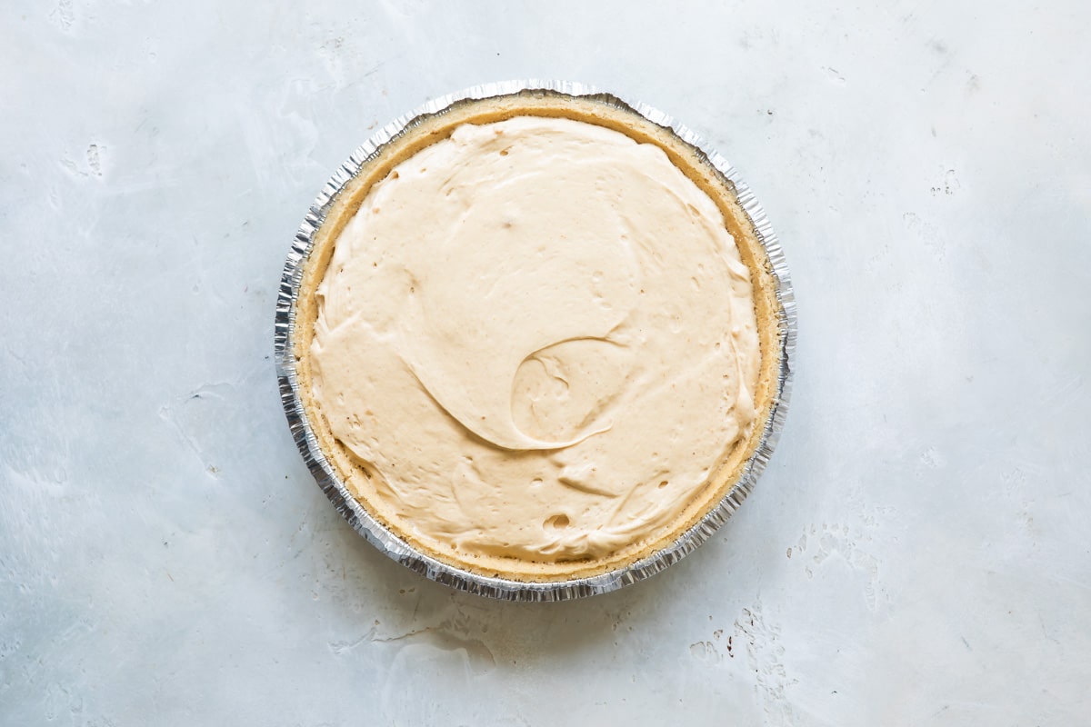 Peanut butter pie filling in pie crust.