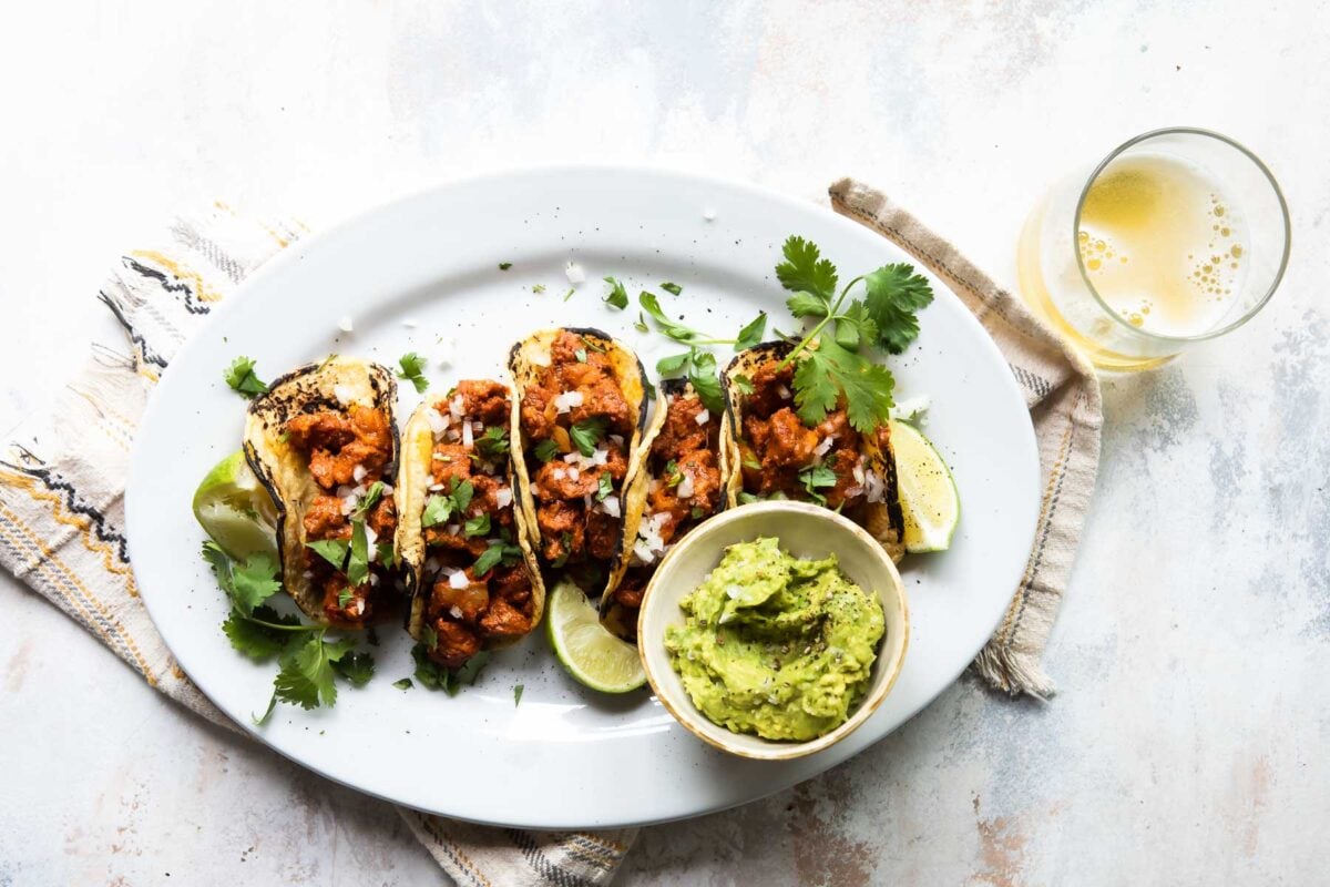 Tacos al pastor on a plate.
