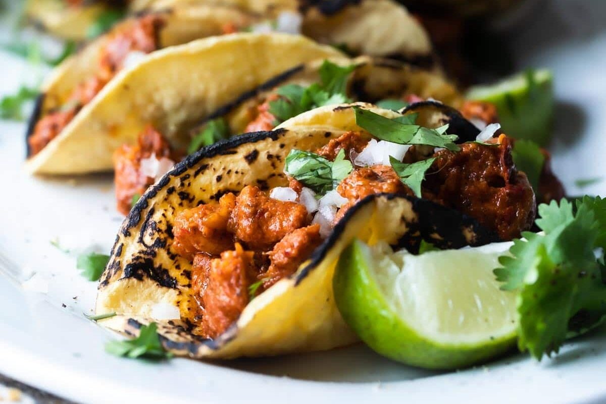 Tacos al pastor on a platter.