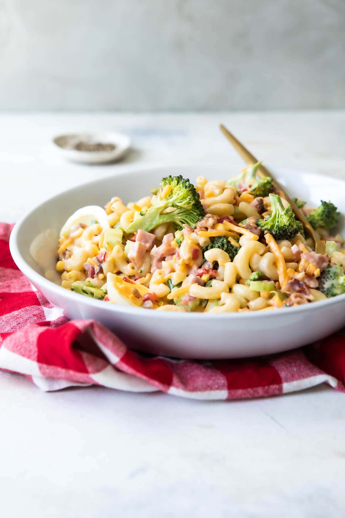 A serving bowl of macaroni salad.
