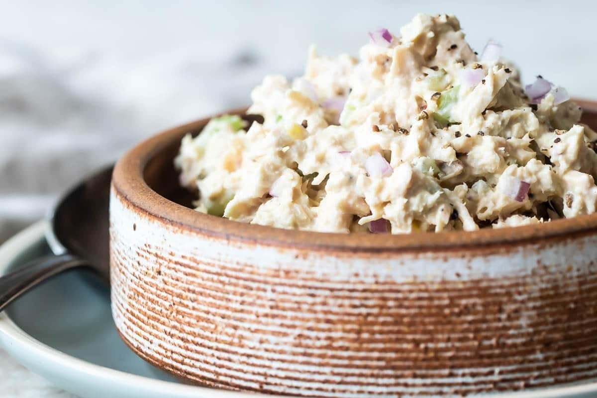 Tuna salad in a brown bowl.