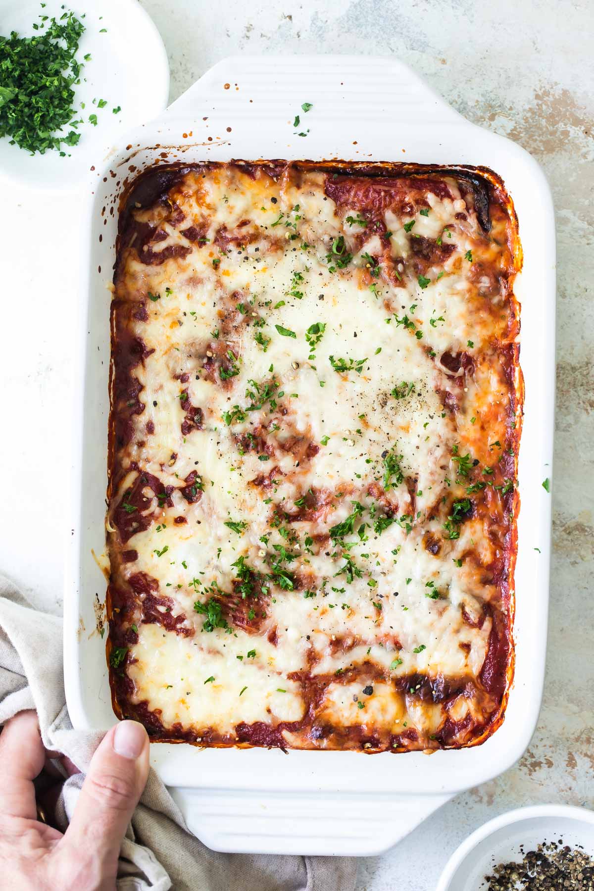 A baking dish of Zucchini Parmesan.