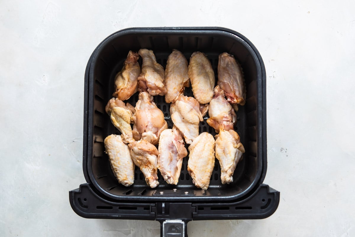 Chicken wings in an air fryer.