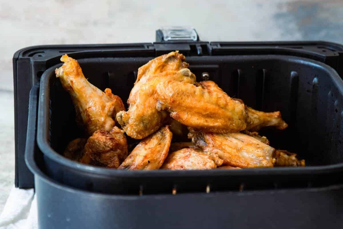 Air fryer chicken wings in an air fryer.