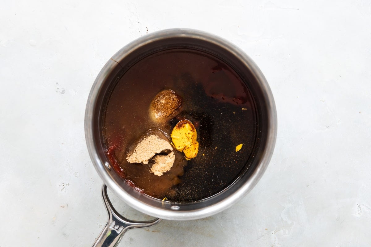 Ingredients for barbecue sauce in a saucepan before being mixed.