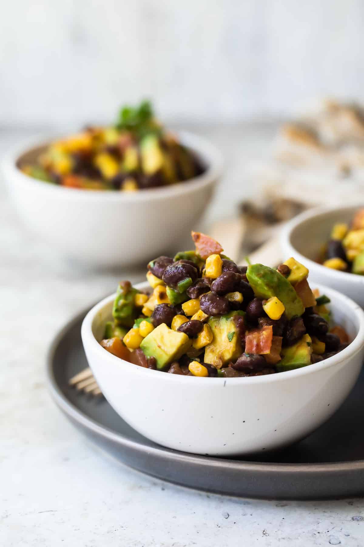 Black bean salad in three bowls.