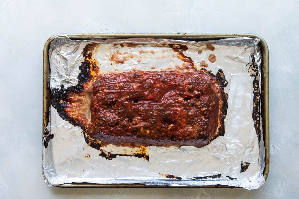 Meatloaf on a baking sheet after being baked.