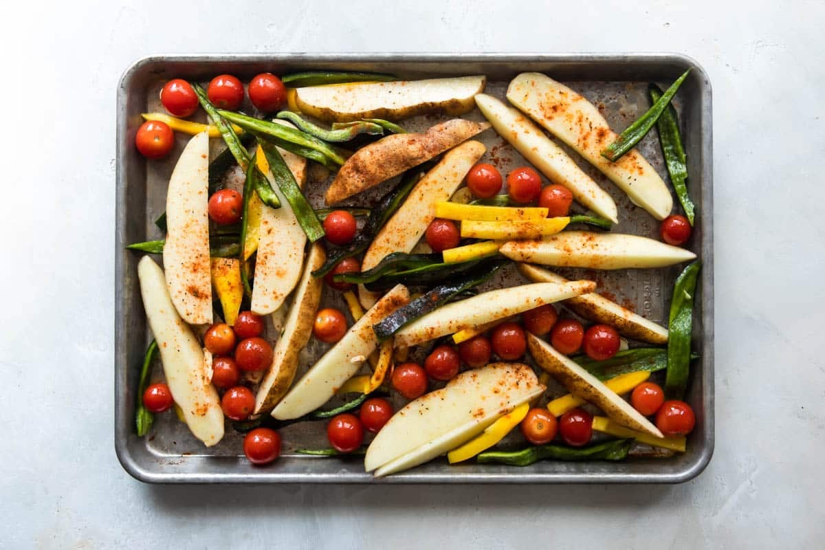 Paprika vegetables on a baking sheet before being baked.