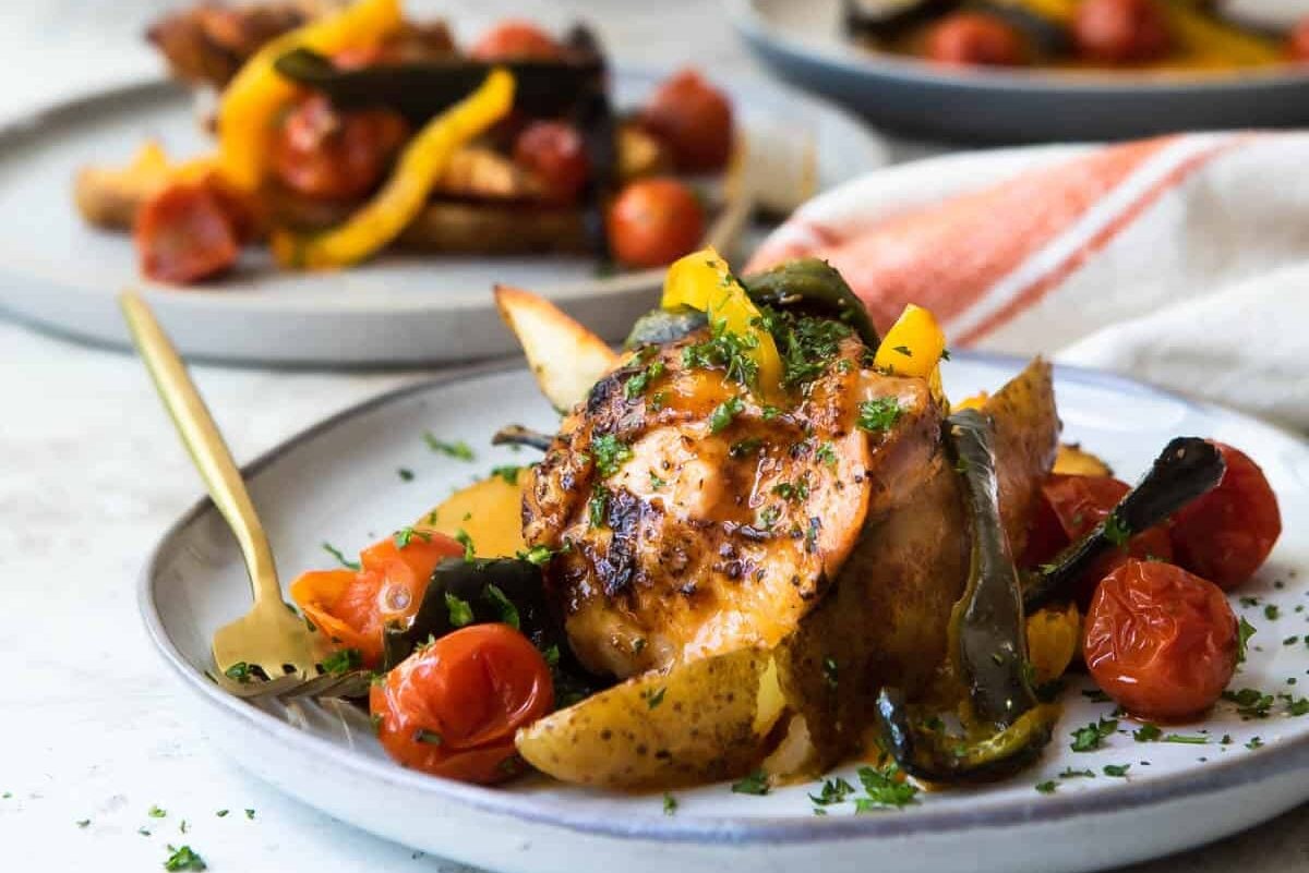 Plates of Paprika Chicken and vegetables.