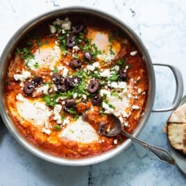 Shakshouka in a silver pan.