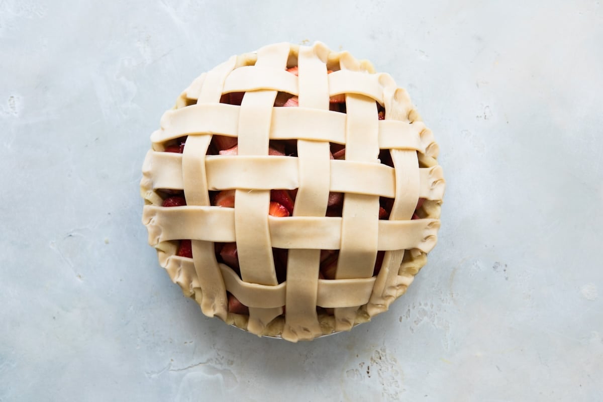 A strawberry rhubarb pie before being baked.