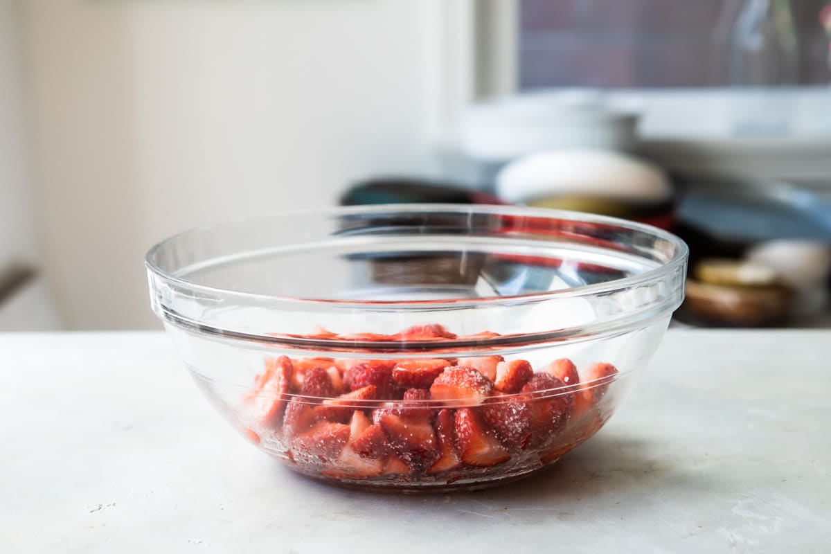 Strawberries in a clear bowl.