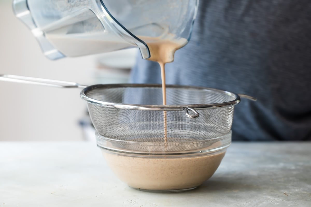 Adding sweetener to horchata.