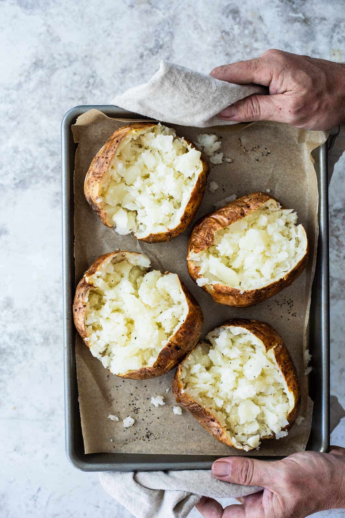 A tray of baked potatoes.
