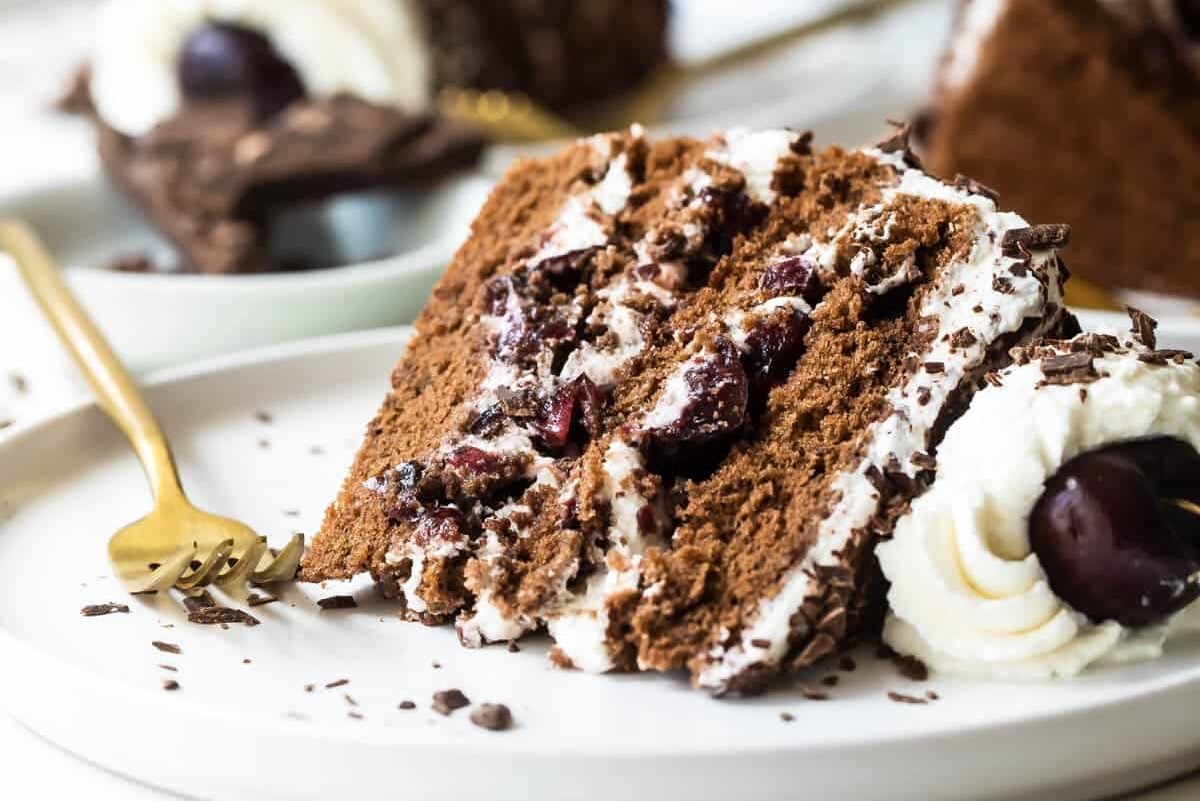 Slices of black forest cake on plates.