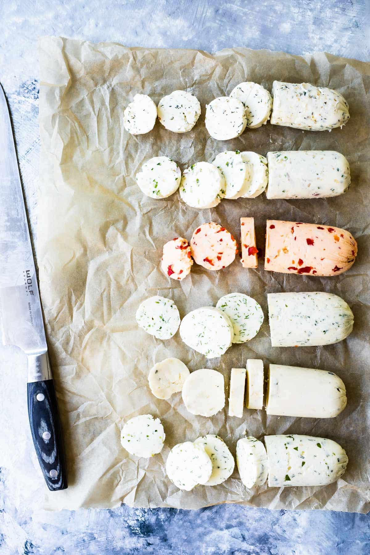 6 rolls of compound butter in a line.