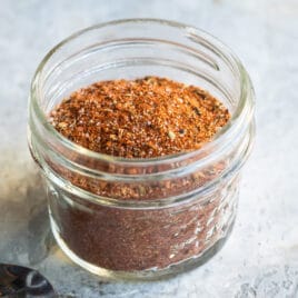 Creole seasoning in a clear spice jar.