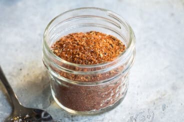 Creole seasoning in a clear spice jar.
