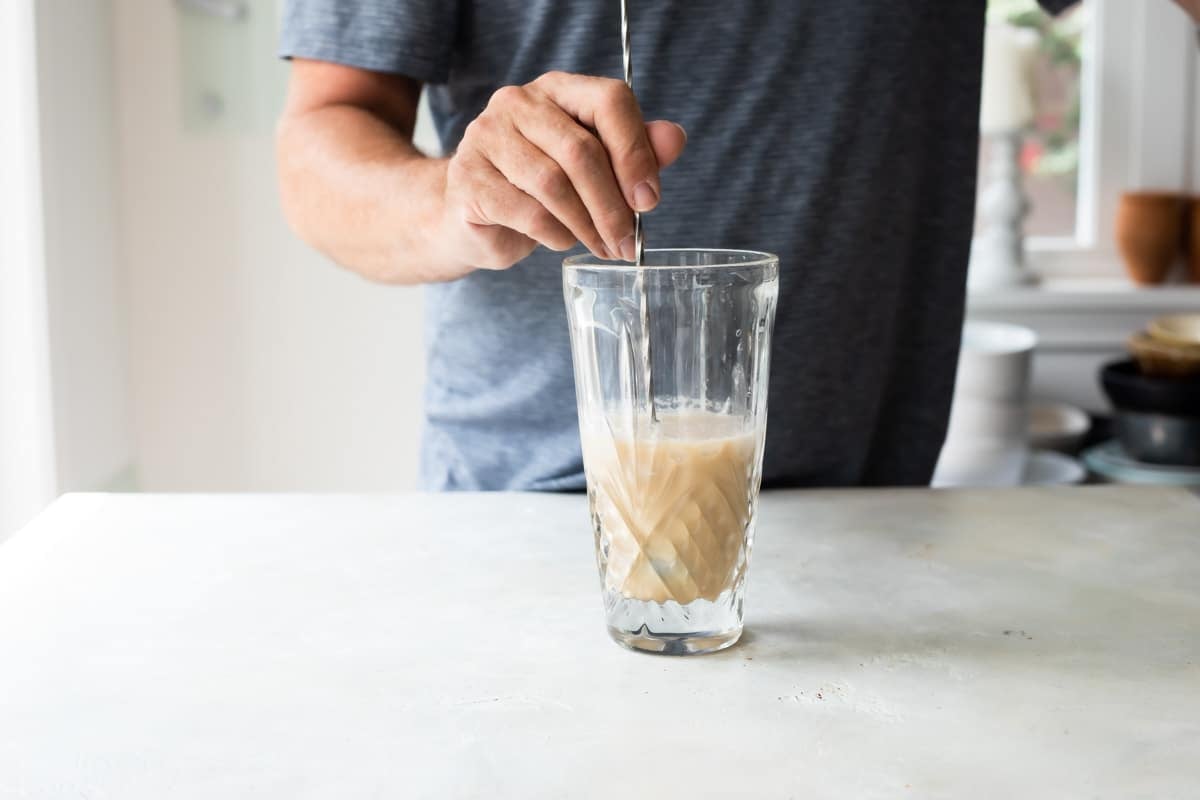 Making an espresso martini in glass.
