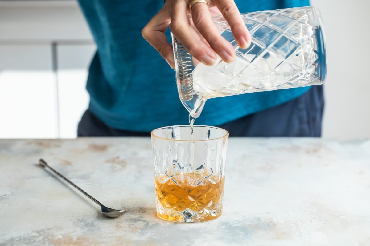 Making an Old Fashioned cocktail.