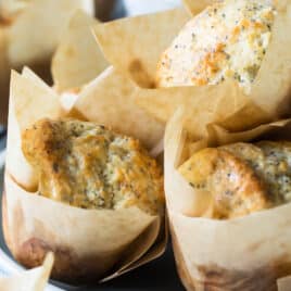 Lemon poppy seed muffins on a plate.