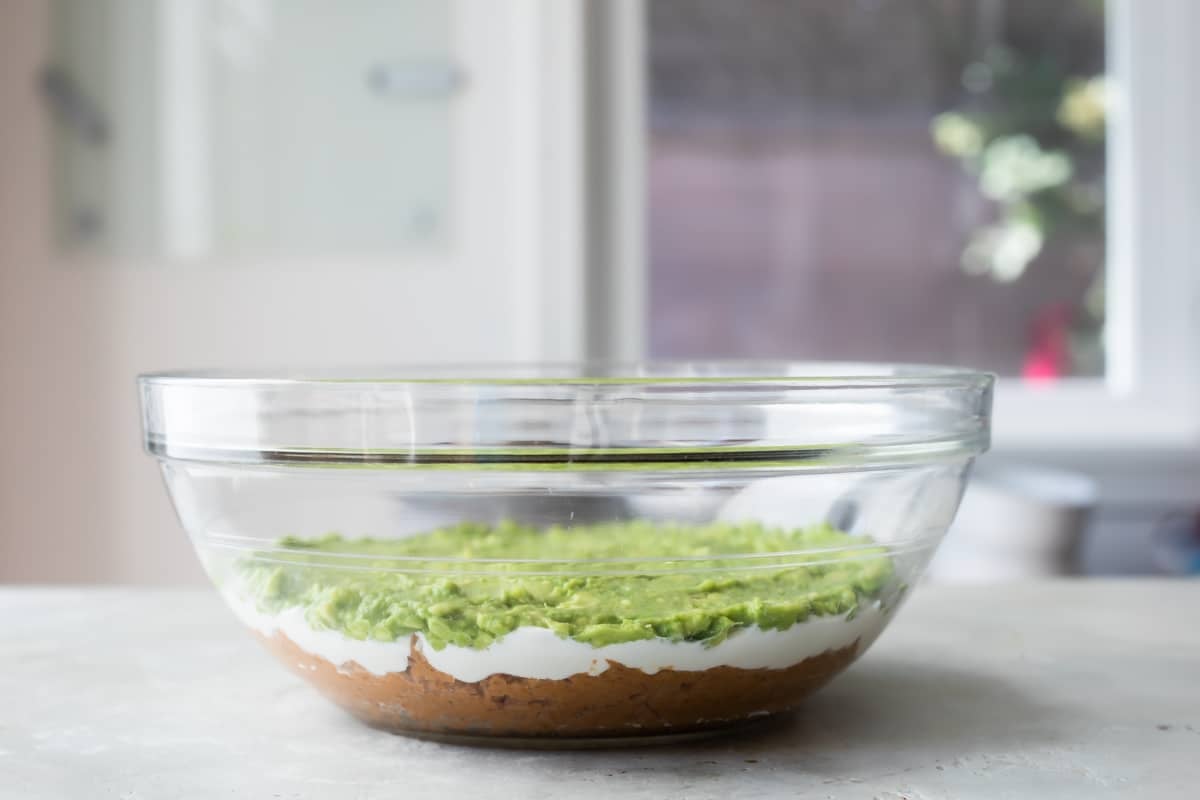 Making seven layer dip.