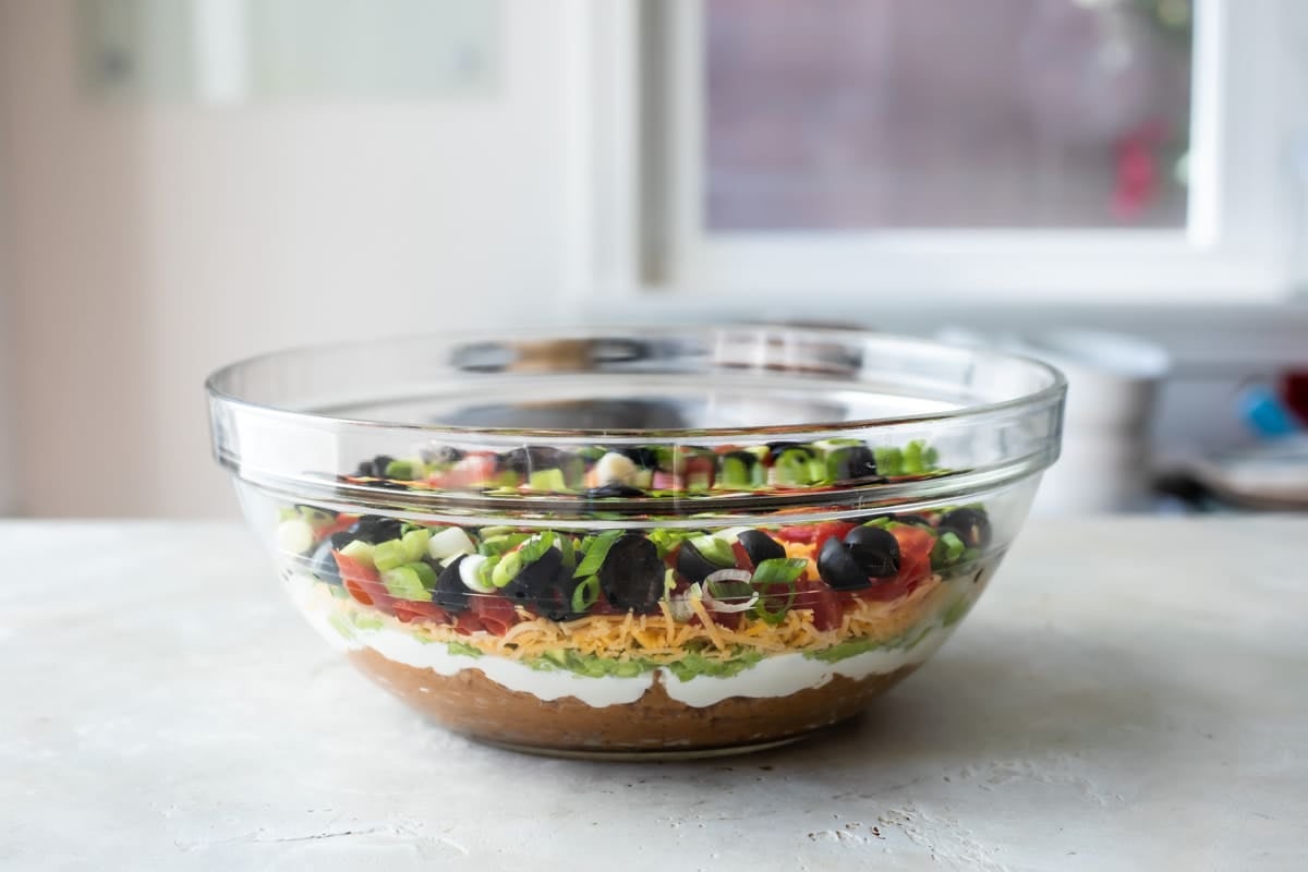 A bowl of seven layer dip.