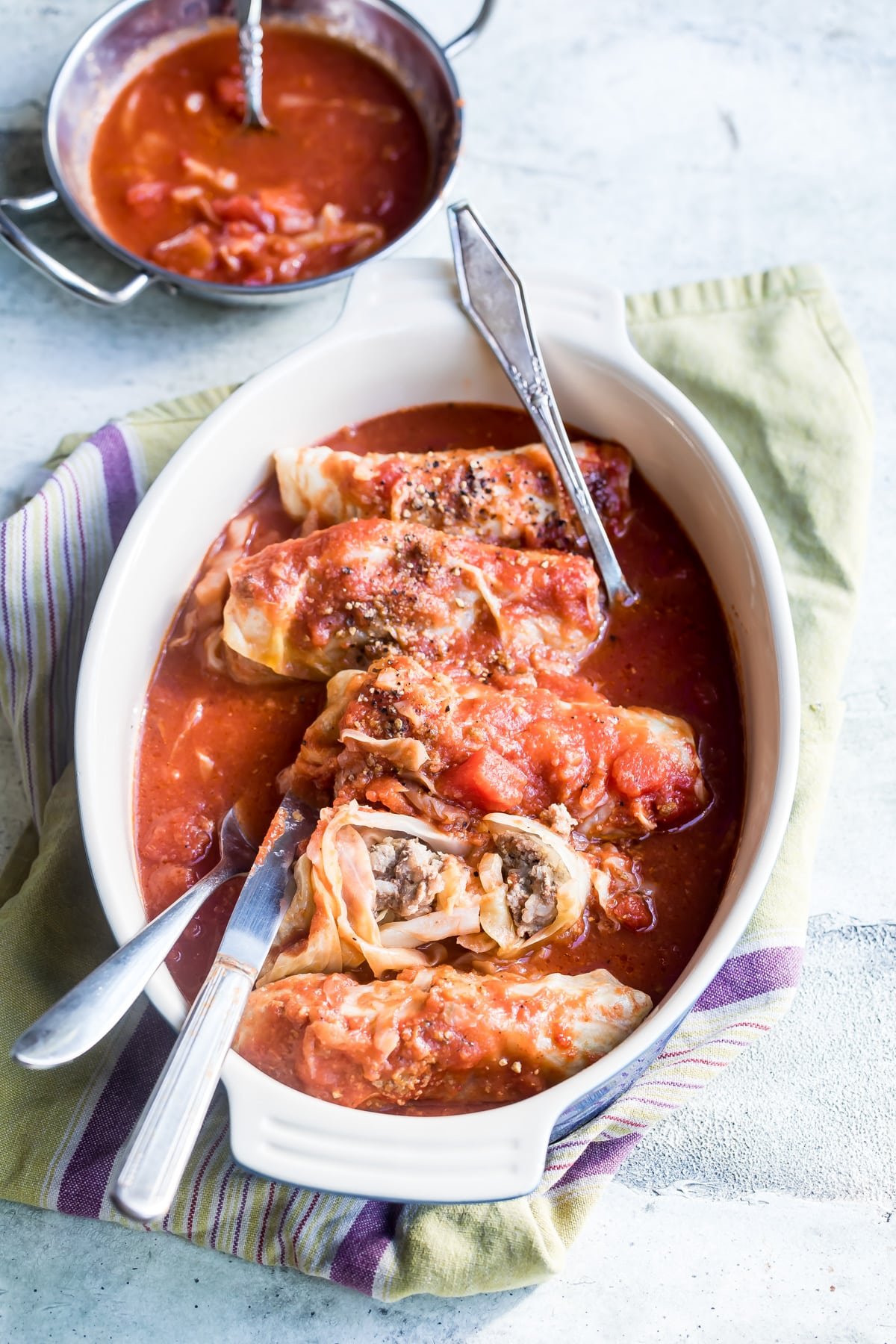 Stuffed cabbage rolls in a casserole dish.