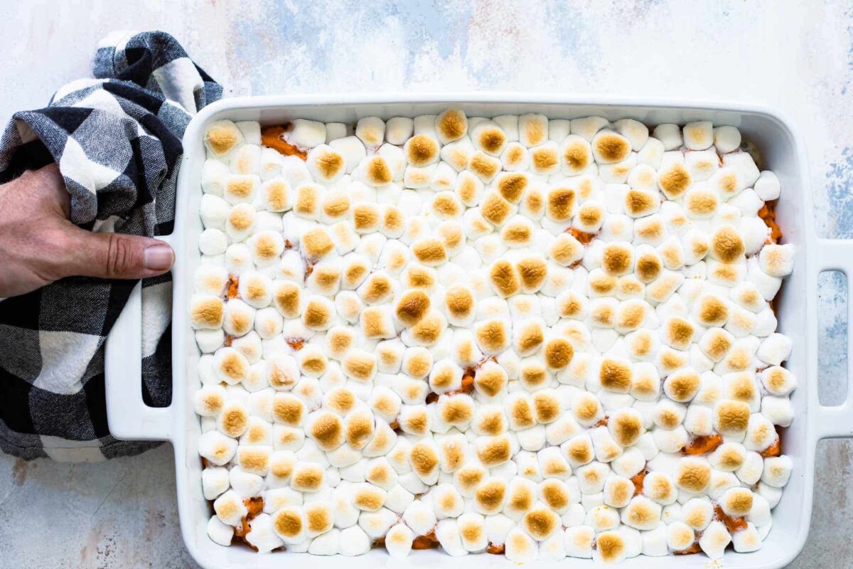 Sweet potato casserole in a white casserole dish.