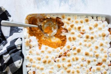 Sweet potato casserole in a white casserole dish.