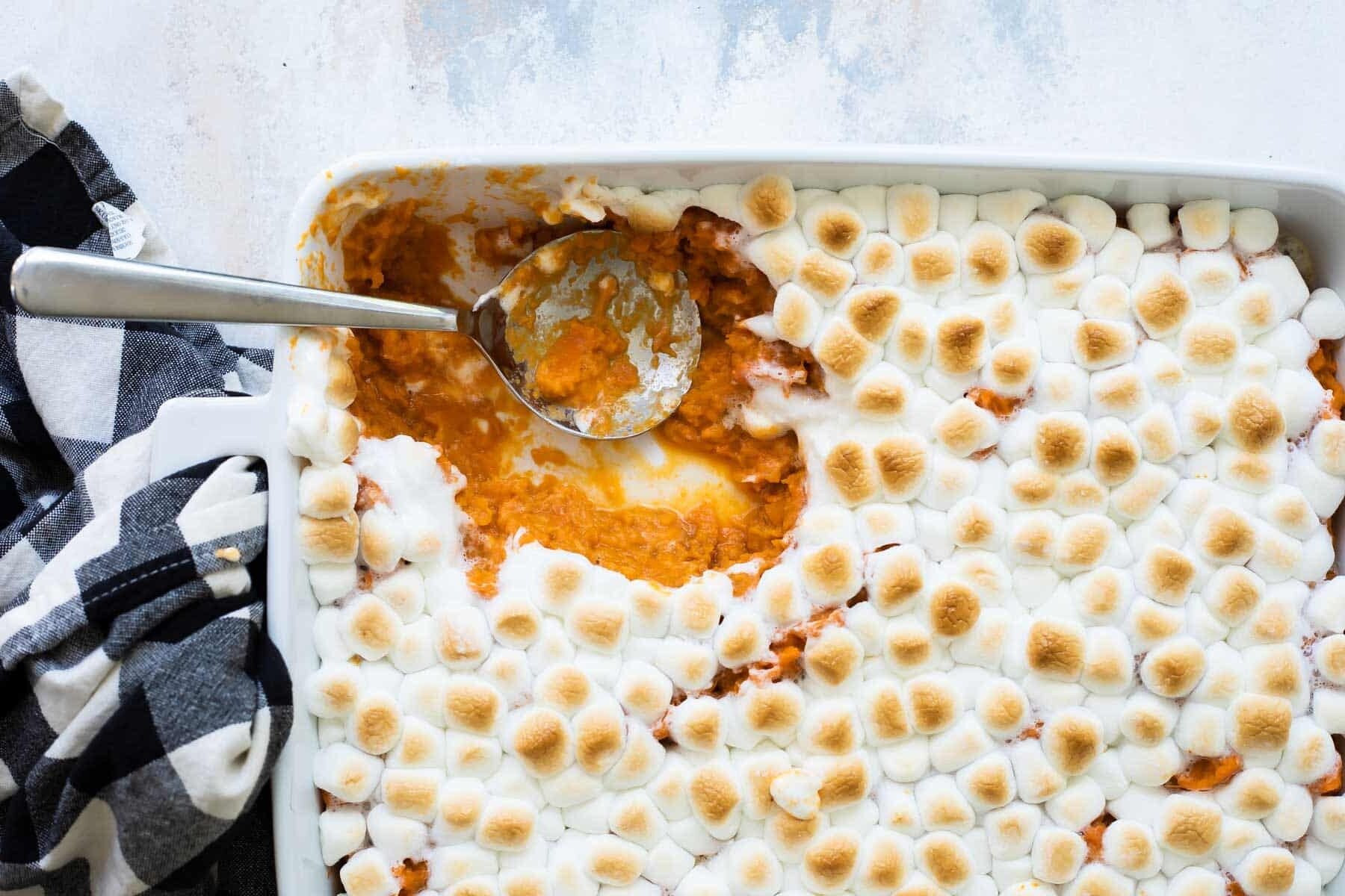 Sweet potato casserole in a white casserole dish.