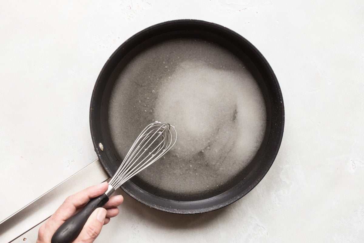 Dissolving sugar in warm water.