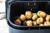 Air Fryer Meatballs in an air fryer basket.