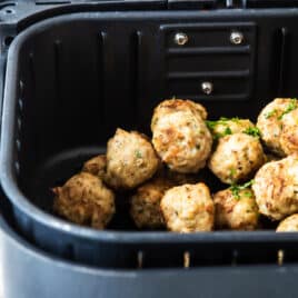 Air Fryer Meatballs in an air fryer basket.
