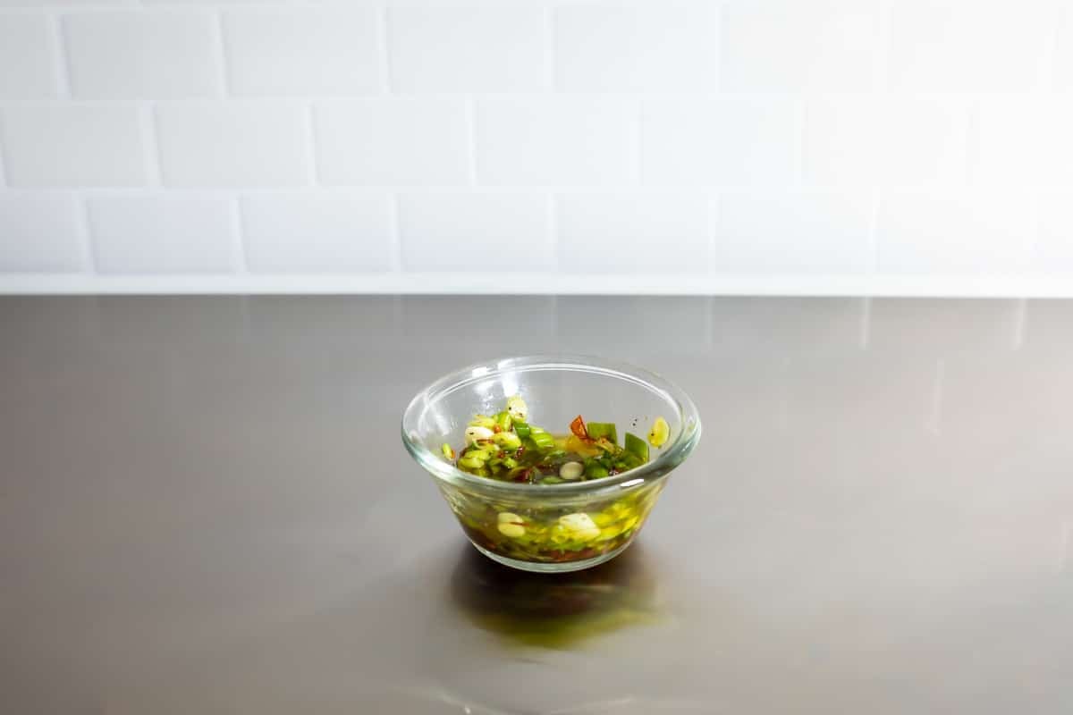 A bowl of Chipotle-honey vinaigrette for corn salad.