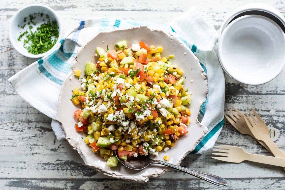 A serving platter of Corn Salad on a blue and white napkin.